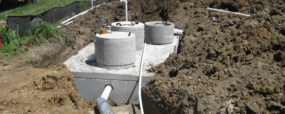 Septic system repair and installation site with tank access ports in Kenosha, WI